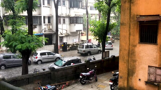 Cars reverse and forward as they realise that the street ahead is completely underwater