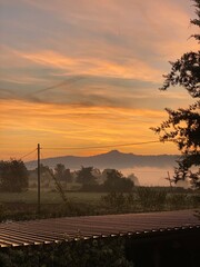 Faded sunrise in the clouds