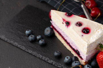Soft berry souffle cake decorated with berries