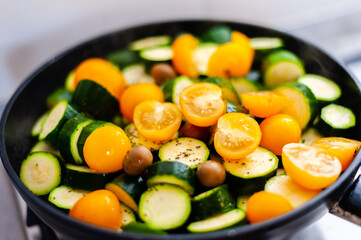 vegetarian dish, italian food cooked vegetables, tomatoes, courgettes, olives, oregano, mediterranean diet