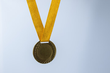 Gold medal on white background concept for winning or success