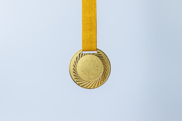 Gold medal on white background concept for winning or success