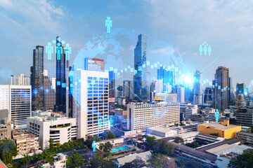 Social media icons hologram over panorama city view of Bangkok, Asia. The concept of people networking and connections. Double exposure.