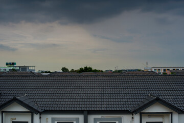 Dark sky while storm is coming over  home roof