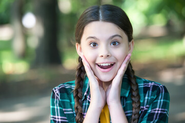 Fototapeta premium Essence of skincare. Happy girl smile outdoors. Natural skincare. Beauty look of little child. Summer skincare routine. Baby skin care cosmetics. Youll love what you see