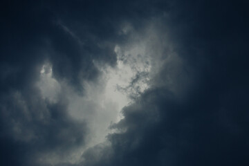Fototapeta na wymiar dark sky. Light in the dark and dramatic storms clouds