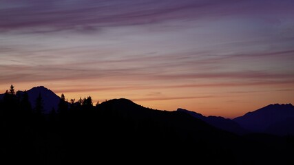 beautiful colorful sunset on the mountains with view to the alps