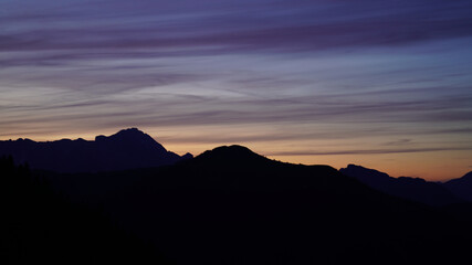 beautiful colorful sunset on the mountains with view to the alps