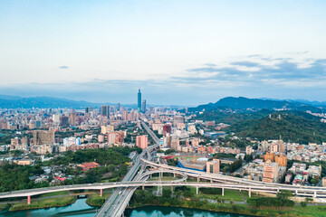 Obraz premium Taipei City Aerial View - Asia business concept image, panoramic modern cityscape building bird’s eye view under sunrise and morning blue bright sky, shot in Taipei, Taiwan