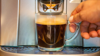 Hand holding coffee cup, selective focus