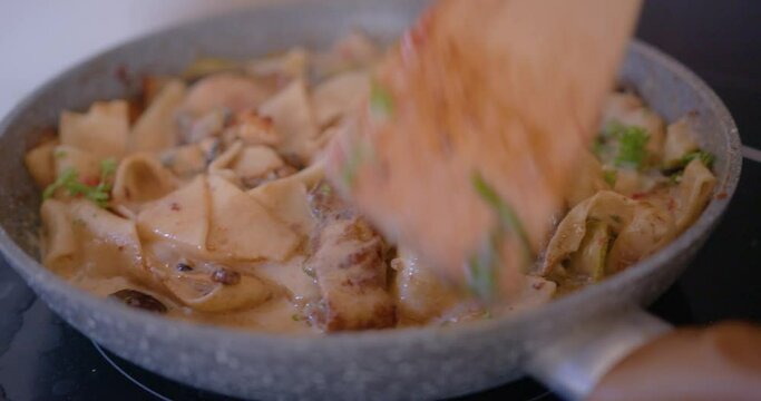 Woman cooks Pasta
