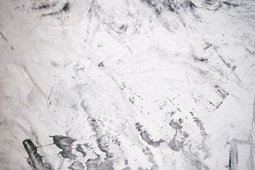 Concrete background with black and white streaks