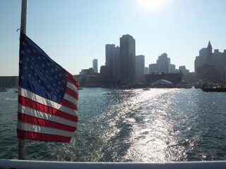 American Flag with Boston Massachusetts city skyline from the water 2008