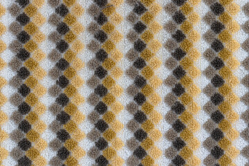 Background vertical checked pattern of beige, brown, gold, and yellow