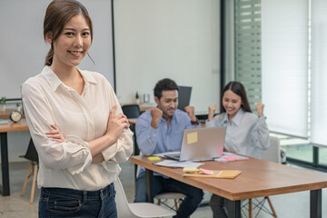 Young business group explaining new business ideas to peers. Business people discussing in meeting room.