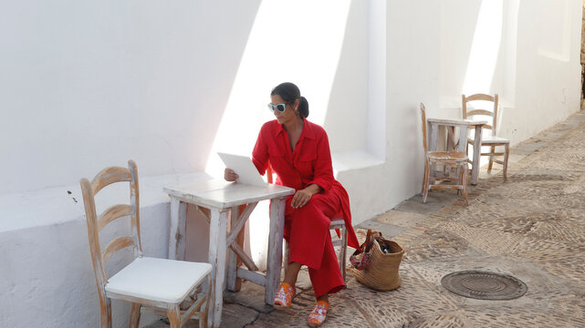 mature woman tourist walking and relaxed in Vejer de la Frontera province of Cadiz in Andalusia, Spain