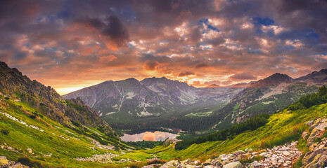 Fototapeta na wymiar Sunset panorama in High Tatras mountains national park. Mountain popradske lake in Slovakia. Panorama.