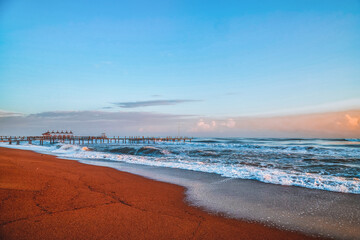 Water of sea and sky with clouds and sunset.