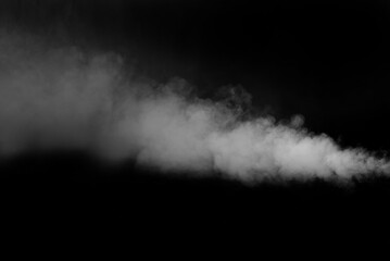 White smoke on a black background. The texture of scattered smoke. Blank for design. Layout for collages.