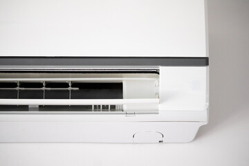 Air conditioner on white wall room interior background