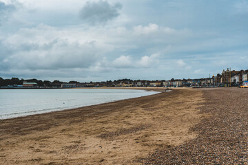 Fototapeta na wymiar Sand and pebble beach at the popular seaside town of Weymouth in Dorset UK