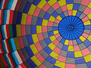 A soft focus, peaceful picture of the colorful inside of a hot air balloon.