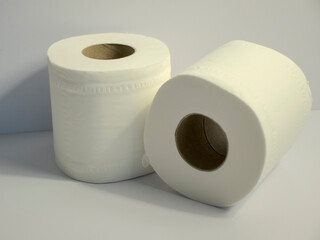 Closeup shot of 2 toilet rolls on white background