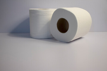 Closeup shot of 2 toilet rolls on white background
