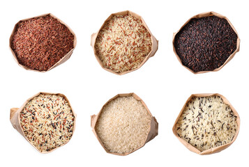 Set with different types of rice in paper bags on white background, top view