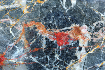 Gold, red and white patterned structure of dark gray marble (Gold Russia) for design.