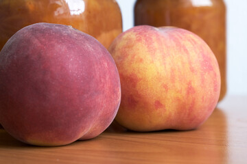 Ripe sweet whole peaches and jam
