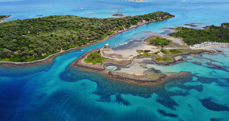 Fototapeta na wymiar Exotic sunny islands ideal for summer vacation. Shot taken from a drone