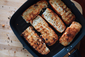 The crispy seared bread in the skillet