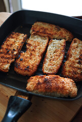The crispy seared bread in the skillet