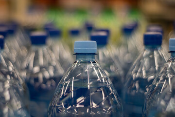 Plastic bottles with drinking water inside. Drinking bottled water.