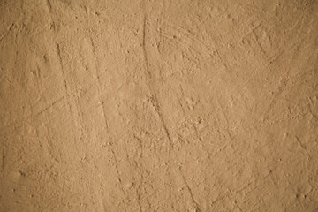 close-up of the clay wall of a brown-colored village house, texture