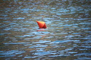 orange buoy on the water
