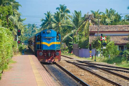HIKKADUWA, SRI LANKA - FEBRUARY 21, 2020: Passenger train arrives on Hikkaduwa station
