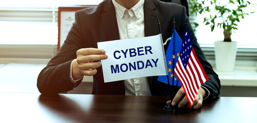 man take a flag with text Cyber Monday with flags on the office background