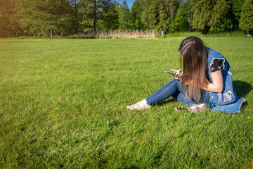 Student girl person work on tablet, computer in summer park. Online woman in nature outside. Laptop outdoor business technology. Electronic gadgets distance learning concept.