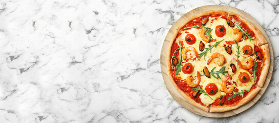 Top view of hot delicious pizza on white marble table, space for text. Banner design