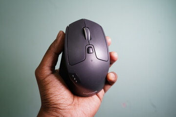 Logitech M720 triathlon wireless mouse in hand