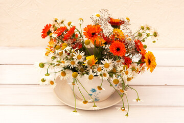a bouquet of garden flowers in a vase. flower composition