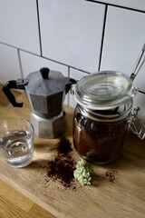 jar with coffee and a glass of water