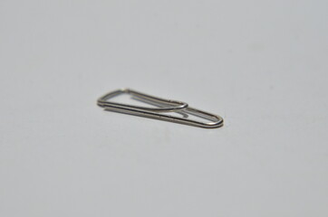 Close Up Metal paper clip on a white background