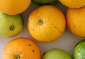 Beautiful lemons and oranges arranged on a table. A fruit rich in vitamin c.