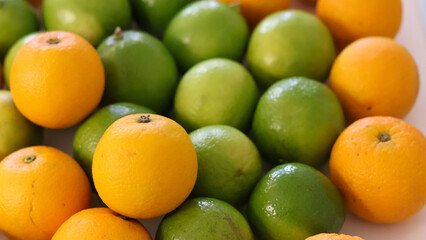 Beautiful lemons and oranges arranged on a table. A fruit rich in vitamin c.