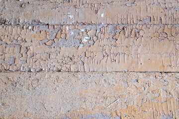 Peeling red paint on boards