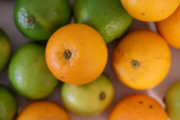 Beautiful lemons and oranges arranged on a table. A fruit rich in vitamin c.