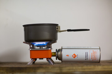 Camping tourist burner and gas cylinder with coffee jezve.